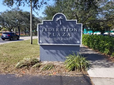 Outdoor sign for Federation Plaza Apartments
