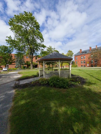 Gazebo in a landscaped outdoor space at Loring House Apartments