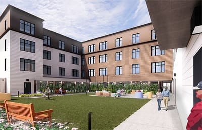 Outdoor view of the facility's courtyard with residents and gardens