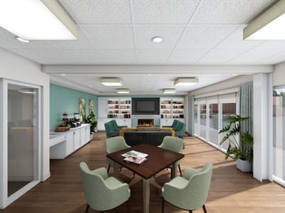 Common area of a senior living facility with seating and decor