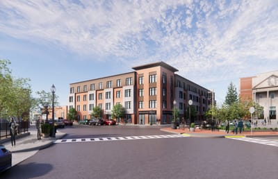 Exterior view of Logan Square Residences with nearby trees and people