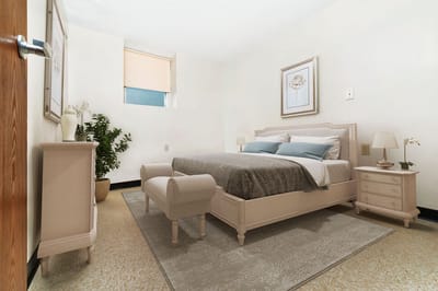 A well-furnished resident bedroom with a cozy atmosphere