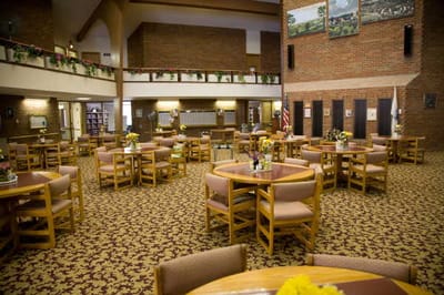 Dining area with tables and floral arrangements