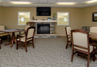 Common area with tables and chairs in a cozy setting