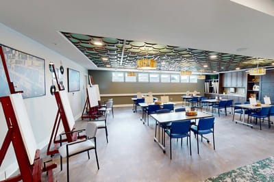 Bright activity room with tables and chairs