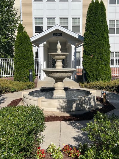Beautiful outdoor fountain with landscaped area