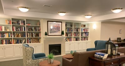 Cozy common area with bookshelves and seating