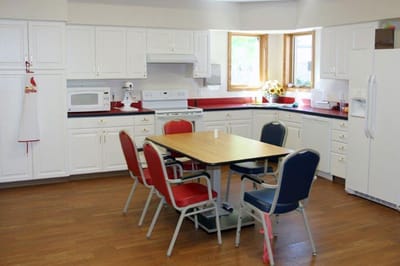 Bright kitchen area with a dining table and chairs