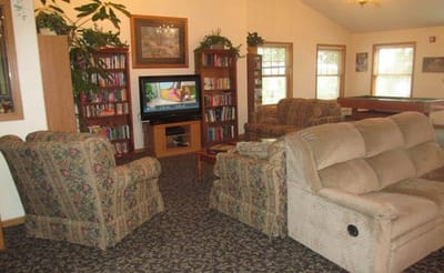 Common area with seating and bookshelves