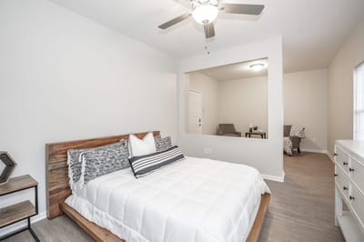 A well-furnished senior living bedroom.
