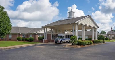 Exterior view of Antioch Valley Senior Living with transportation vehicle