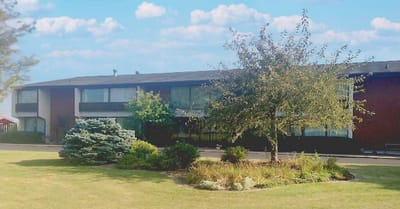 Exterior view of Antioch Valley Senior Living building with landscaping