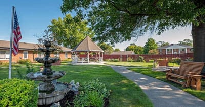 A serene outdoor space with gazebo and fountain
