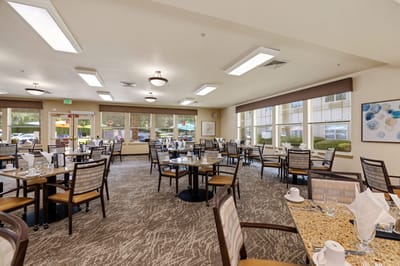 Dining room setup with tables and chairs