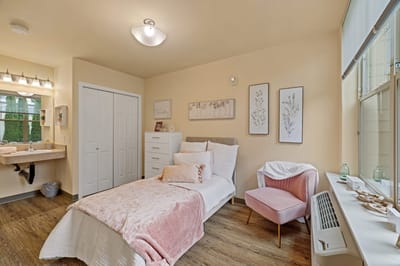 A well-decorated private resident room with furnishings