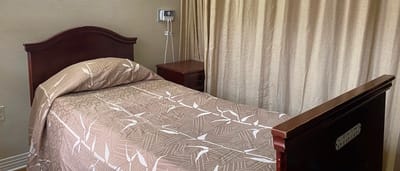 Cozy resident bedroom with a neatly made bed