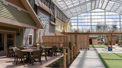 Outdoor patio area with seating and greenery