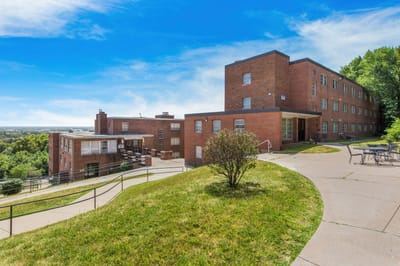 Exterior view of Marycrest Senior Apartments with landscaped grounds