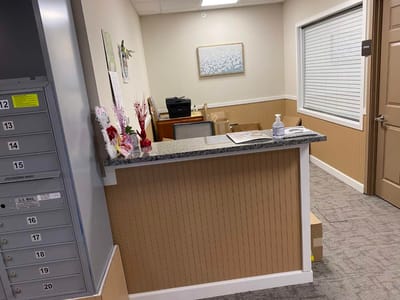 Reception area with a desk and office equipment