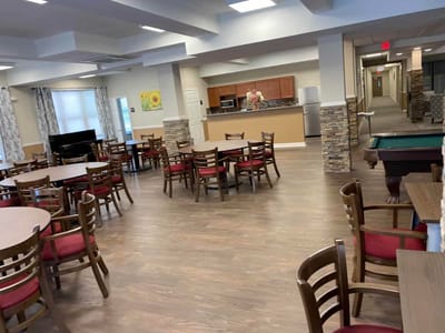 Interior view of a dining area with tables and chairs
