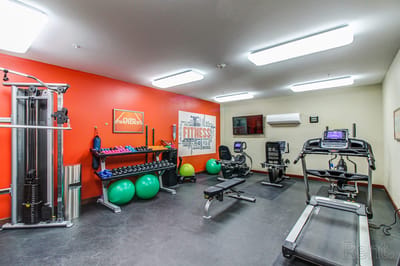 Interior fitness room with exercise equipment