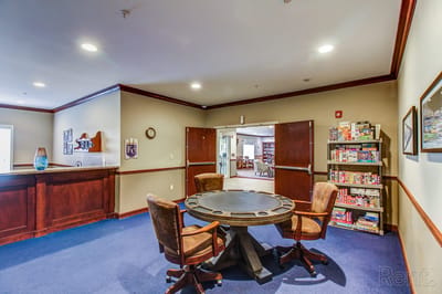 Common area with a table and chairs in the facility