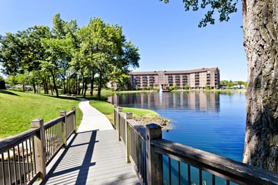Scenic view of a walkway and lake near the facility