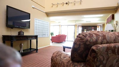 Interior view of a common area with seating and calendar