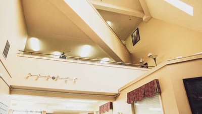 Interior view of a spacious common area with high ceilings