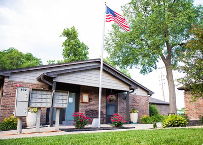 Entrance of Shorey Villa with American flag and flowers