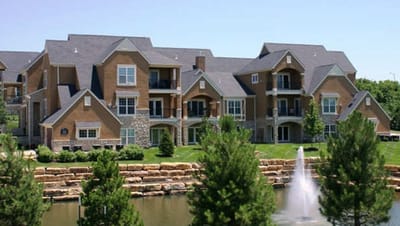 Exterior view of the facility with landscaped pond