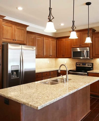 Modern kitchen with granite countertops and appliances