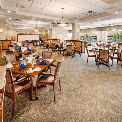 Dining room setup with tables and chairs