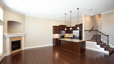 Spacious interior view of a modern apartment kitchen and living area