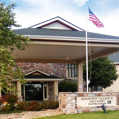 Front exterior of Ridgeview Village II with American flag
