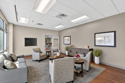 Bright common area with seating and plants