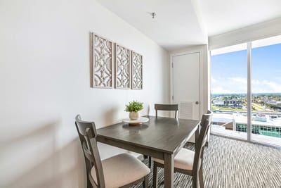 Bright interior view of a dining space with a table and chairs