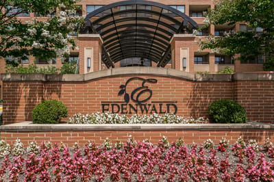 Logo and entrance of Edenwald Senior Living