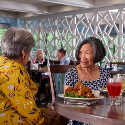 Residents dining and enjoying a meal in the dining room