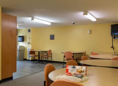 Interior view of a dining area with tables and chairs