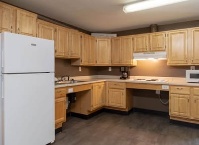 Interior view of a kitchen with wooden cabinets