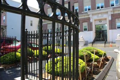 View of the facility's exterior entrance and garden area