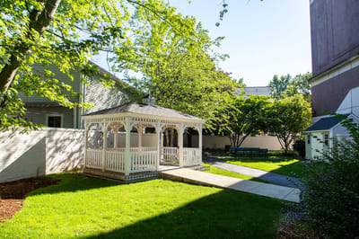 Outdoor gazebo in a green courtyard