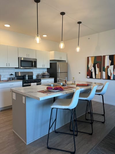 Bright, modern kitchen area with seating