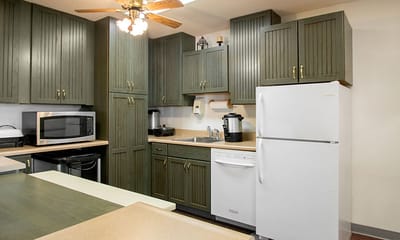 Brightly lit kitchen area with appliances