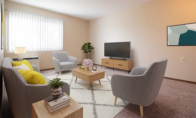 A well-furnished interior living space with two gray chairs