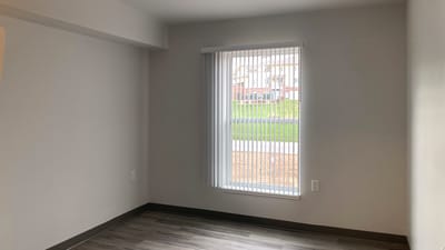 A private room with a window and blinds