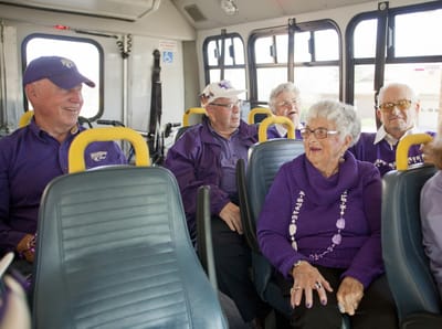 Residents enjoying a ride on a facility bus