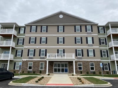Exterior view of Preston Village Senior Apartments building