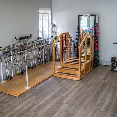 Rehabilitation area with exercise equipment and walking stairs